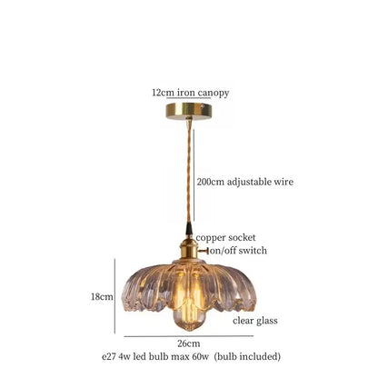 A clear glass pendant lamp with fluted lotus leaf design and brass glass lotus metal accents for dining room decorbites brass glass
