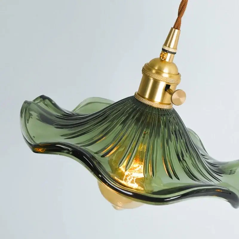 Green wavy glass pendant lamp with brass glass lotus leaf design and brass-finished fixture for dining room decorbites brass glass