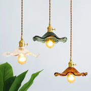 Three brass glass lotus pendant lamps with colored wavy glass shades and twisted cords for dining room decorbites brass glass