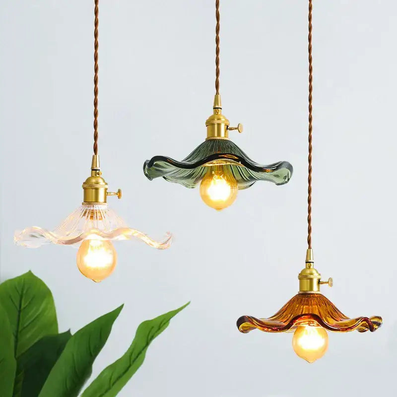 Three brass glass lotus pendant lamps with colored wavy glass shades and twisted cords for dining room decorbites brass glass