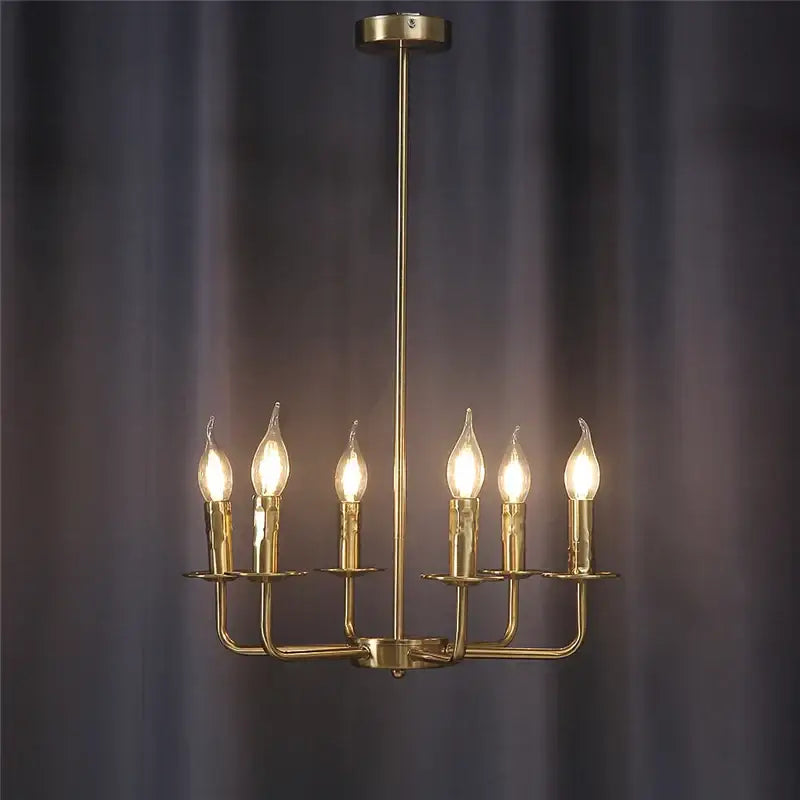 Brass iron art chandelier lights with six lit candle-style bulbs for dining room decorbites iron art chandelier