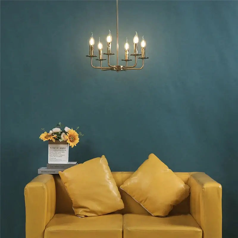 Brass iron art chandelier lights with six lit candle-style bulbs for dining room decorbites iron art chandelier