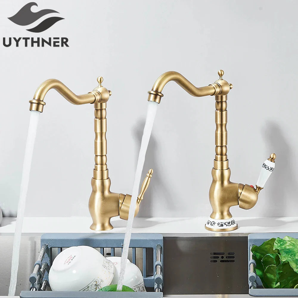 Brass kitchen faucet deck mounted with rotating neck curved spout and ornate segmented body design