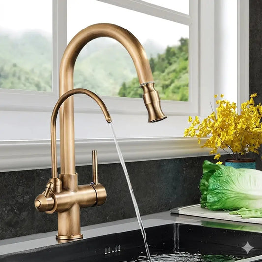 Brass kitchen faucet with pull down spray head and water control feature in a curved brass-finished design