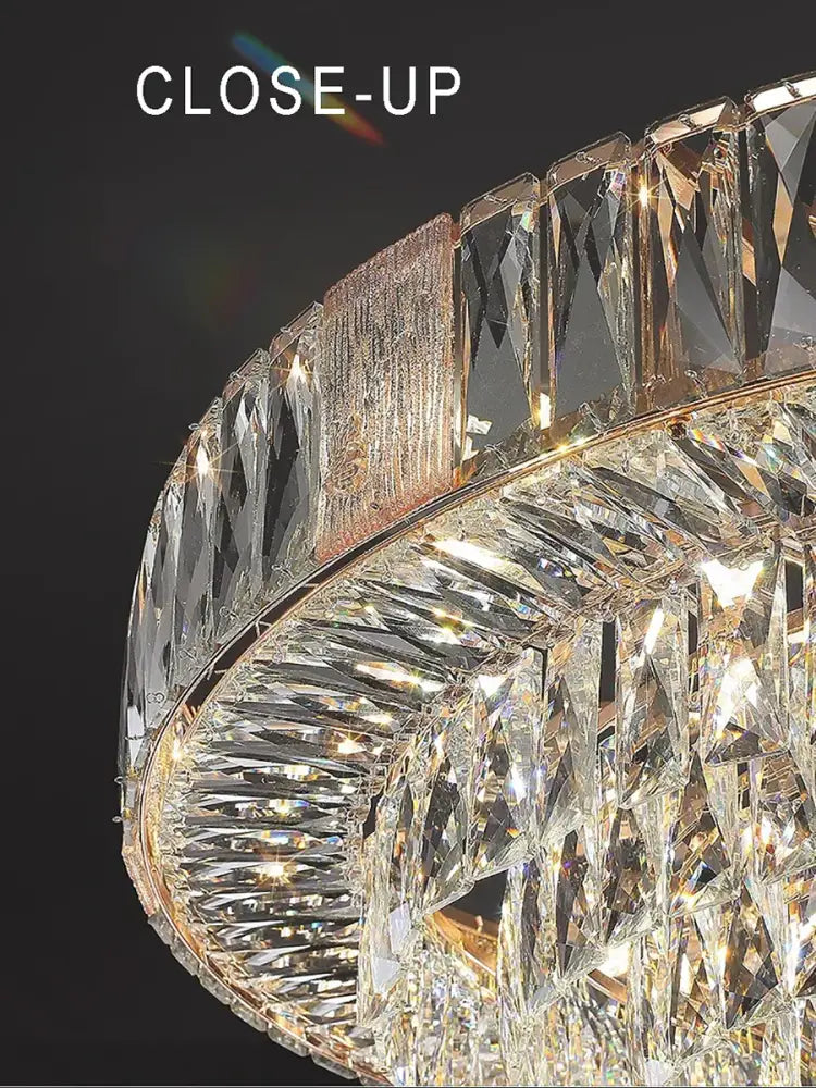 Brass multi tiered decorbites crystal ceiling chandelier with faceted clear crystals and gold-toned metal frame for living room
