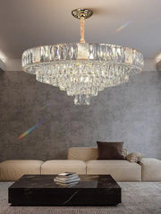 Brass multi tiered decorbites crystal ceiling chandelier with polished brass mount and cascading faceted glass elements