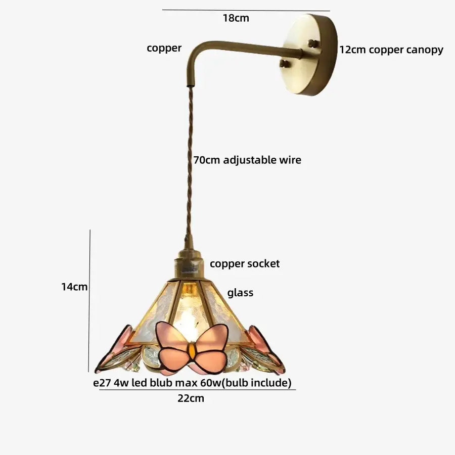 Delicate copper finished wall light fixture with stained glass shade featuring pink and peach butterfly motifs for bedroom