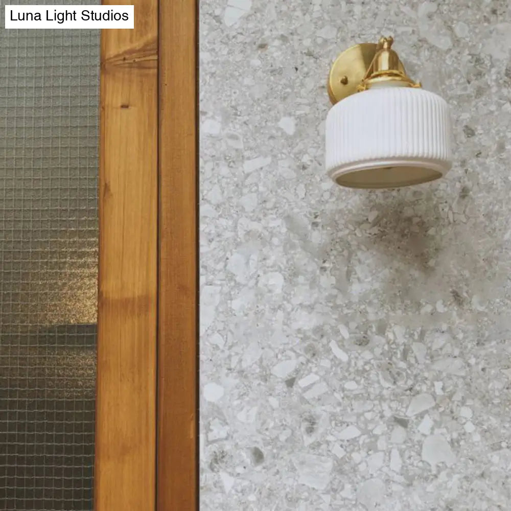 DecorBites™ Brass Pivot Joint Foyer Sconce: Round Ribbed Glass Wall Light with White Simplicity (1 Bulb)