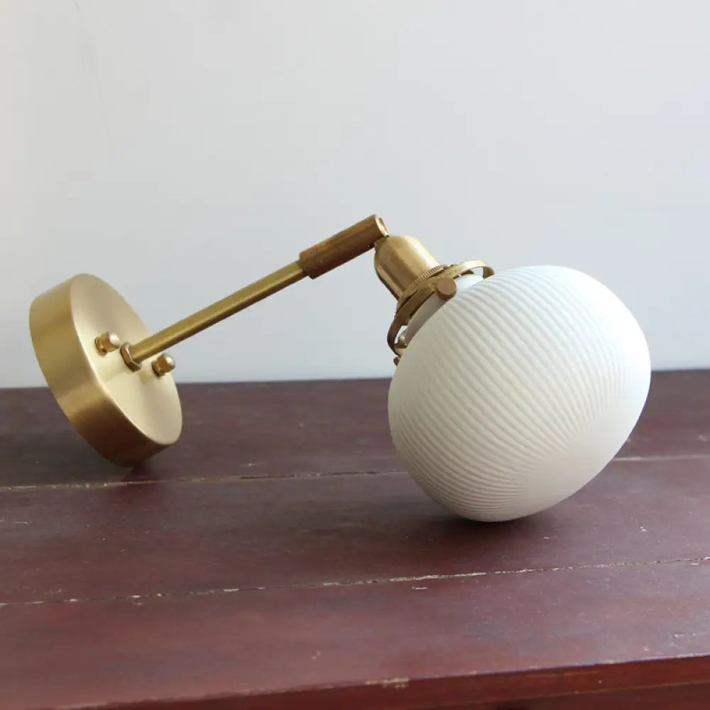 DecorBites™ Brass Pivot Joint Foyer Sconce: Round Ribbed Glass Wall Light with White Simplicity (1 Bulb)