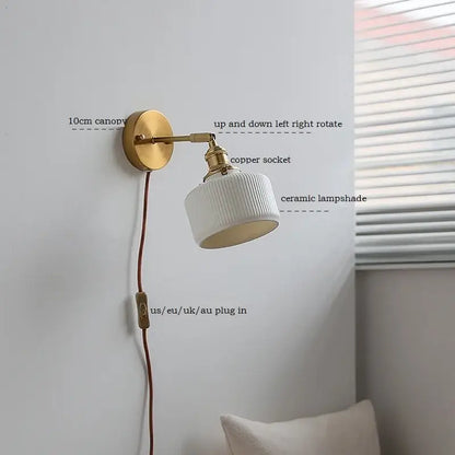White ribbed decorbites ceramic wall sconce with brass finish iron arm and adjustable copper socket for bedroom lighting
