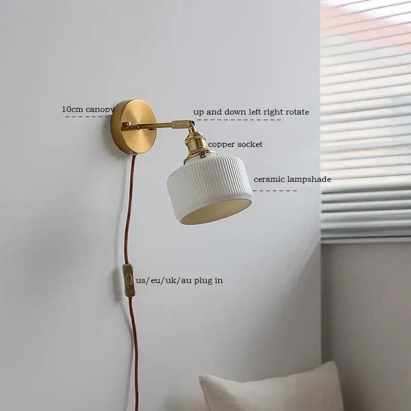 White ribbed decorbites ceramic wall sconce with brass finish iron arm and adjustable copper socket for bedroom lighting