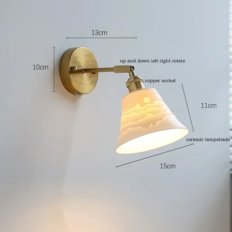 Brass ribbed decorbites ceramic wall sconce with warm-toned lampshade and iron arm for bedroom lighting
