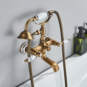 Antique brass shower faucet wall mount with white ceramic handles featuring black floral patterns and cold water control