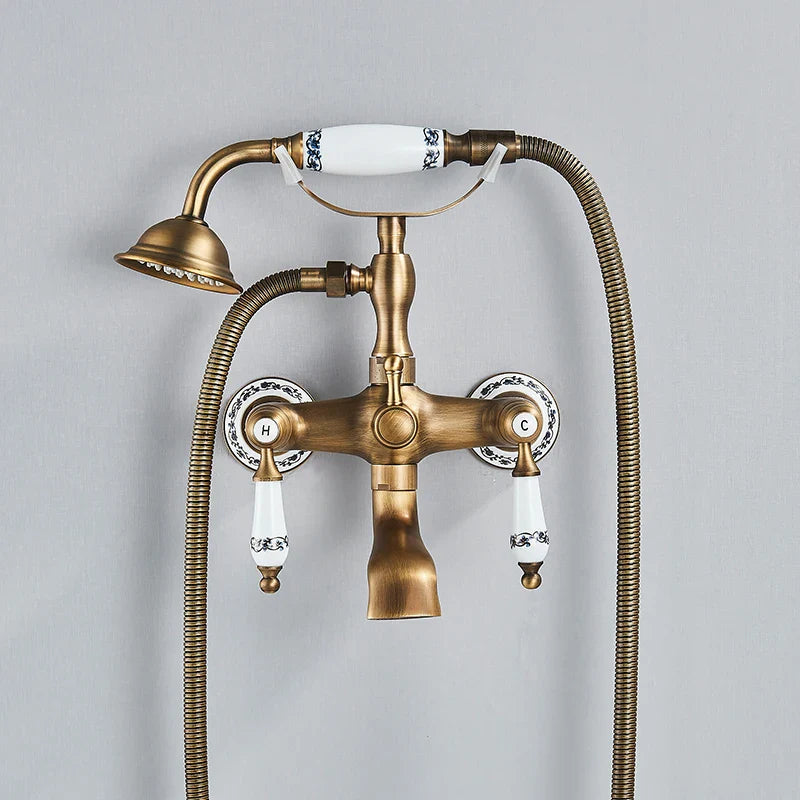 Antique brass shower faucet wall mount with white ceramic handles and blue floral patterns for cold water control