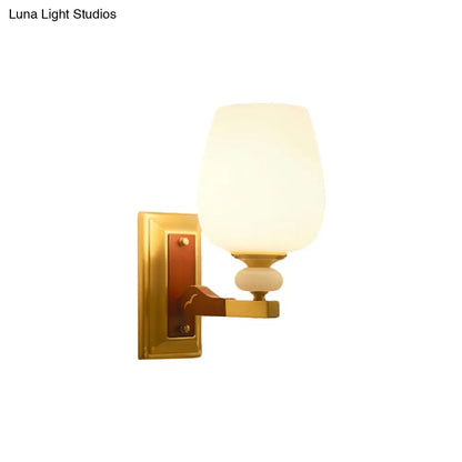 Brass Single Light Wall Mount Lamp with Opal Glass Cup Shape - Angled Wall Lighting Idea