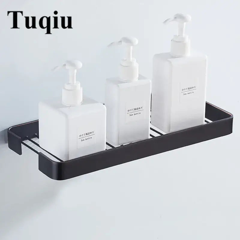 Black metal wall-mounted soap dispenser rack holding three white pumps with decorbites brass square bathroom shower shelf