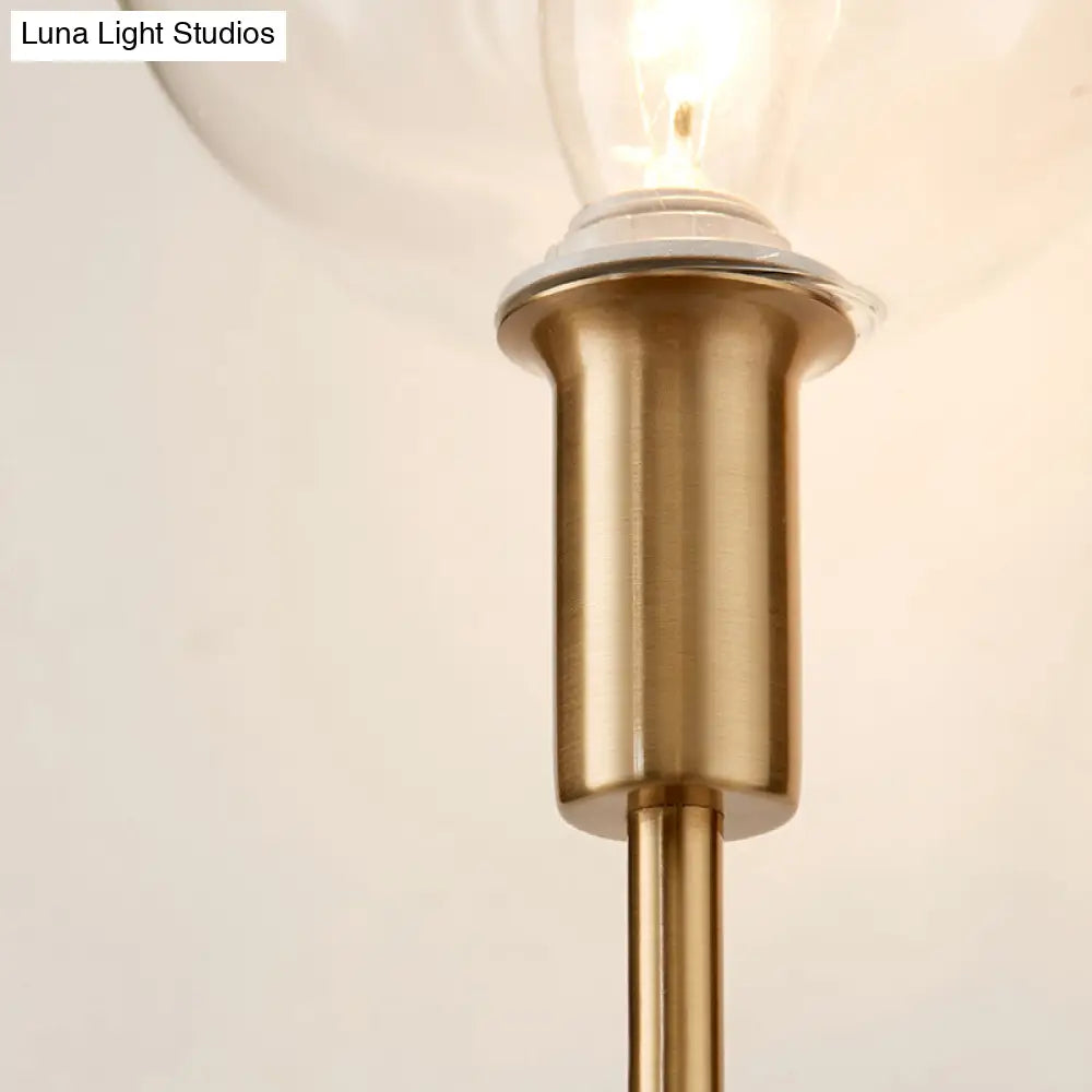DecorBites™ DecorBites™ Brass Wall Lamp with Clear Wine Glass Shade & Modern Pencil Arm Design