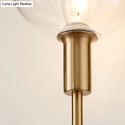 DecorBites™ DecorBites™ Brass Wall Lamp with Clear Wine Glass Shade & Modern Pencil Arm Design