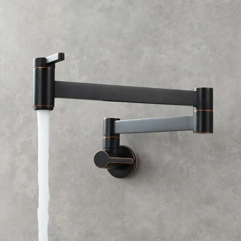 Brass wall mounted pot filler kitchen faucet with black matte finish, articulated gooseneck, and copper-toned accents