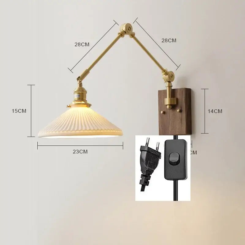 Brass and walnut copper swing arm led wall sconce with brass finish and ribbed frosted glass shade on wooden backplate