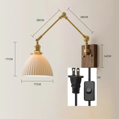 Brass finished adjustable wall sconce with copper swing arm led, ribbed off-white glass shade, and walnut wooden backplate