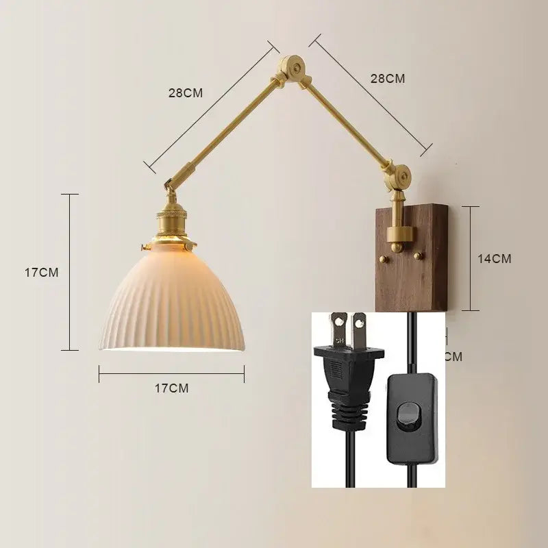 Brass finished adjustable wall sconce with copper swing arm led, ribbed off-white glass shade, and walnut wooden backplate