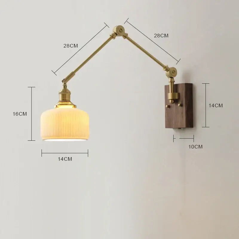 Adjustable brass wall sconce with copper swing arm led, ribbed cream glass shade, and walnut wood mounting plate