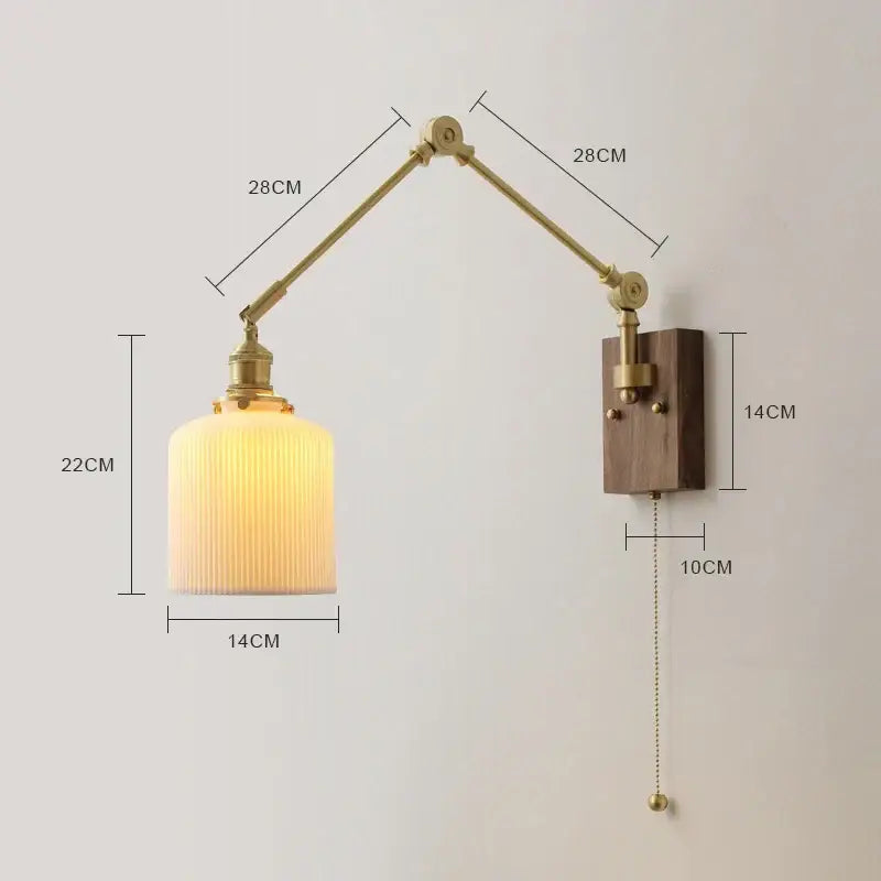 Brass and walnut copper swing arm led wall sconce with brass finish and ribbed cream glass shade for bedroom lighting