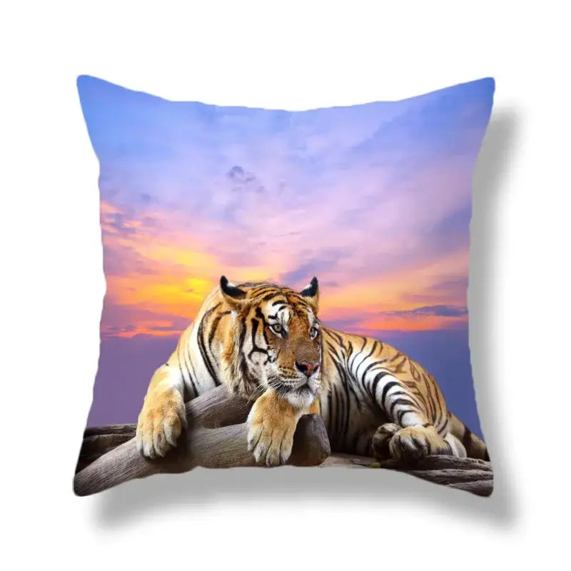 Square throw pillow featuring a brave tiger pattern print with orange and black stripes resting on logs at sunset