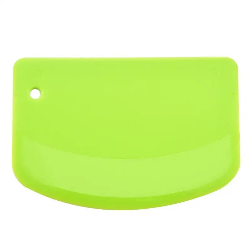Bright green silicone spatula dough cutter with rounded edge and hole for decorbites cake spatula use