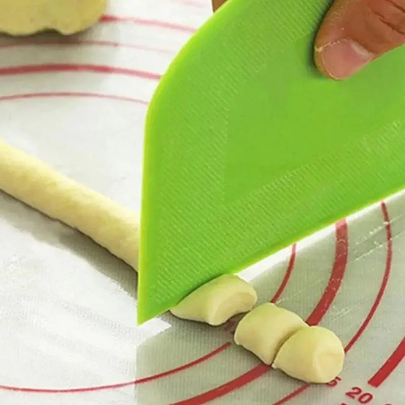 Bright green silicone spatula dough cutter with textured non-slip surface for decorbites cake spatula dough use