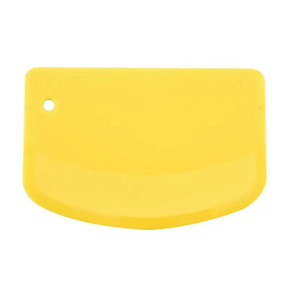 Bright yellow silicone spatula dough cutter with rounded edge and hanging hole for decorbites cake spatula use