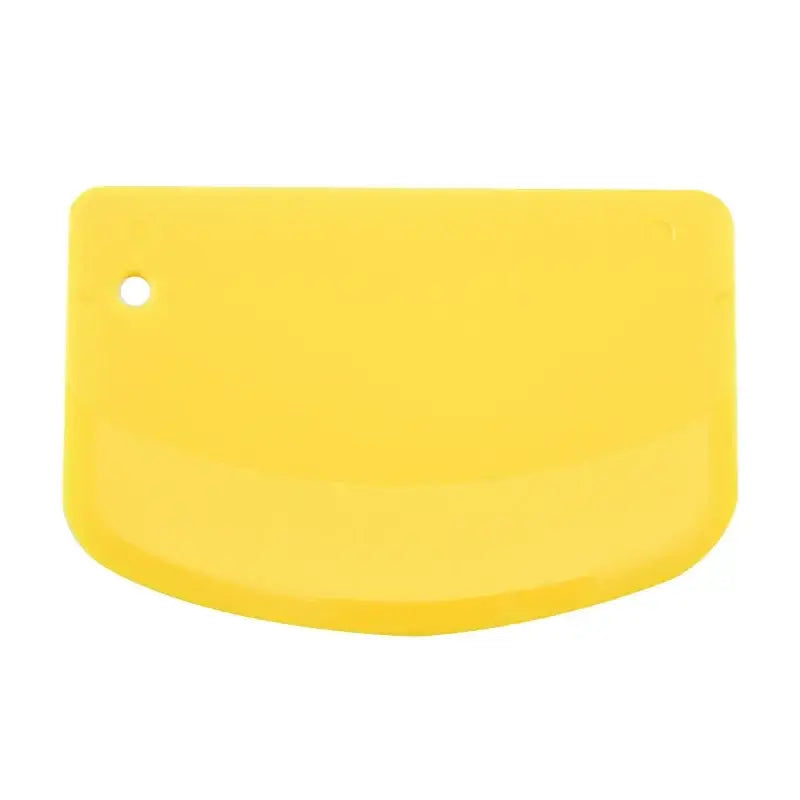 Bright yellow silicone spatula dough cutter with rounded edge and hanging hole for decorbites cake spatula use