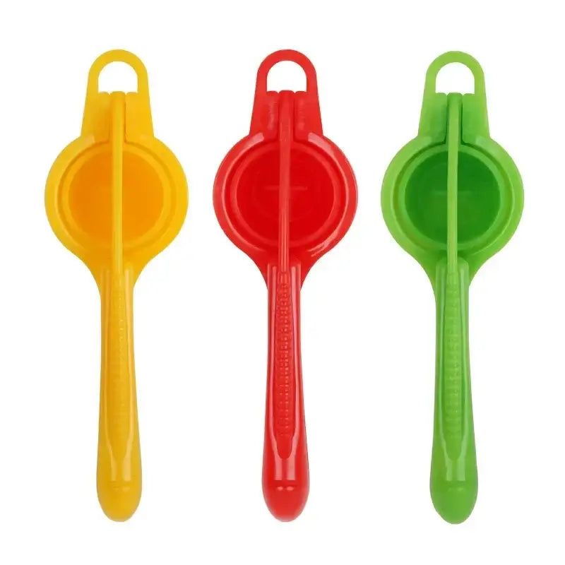 Three colorful plastic manual citrus press juicers in yellow red and green for kitchen fruit squeezing decorbites citrus press