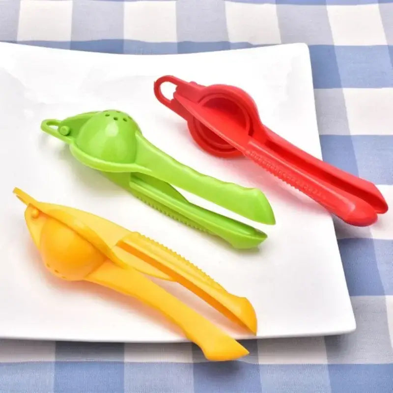 Three colorful plastic citrus press juicers in green red and yellow for kitchen fruit squeezing decorbites citrus press