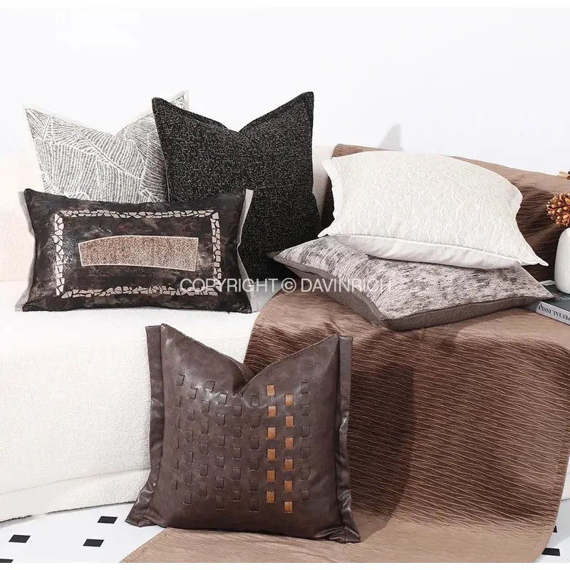 Brown leather throw pillow cushion cover with brighton cross stitch woven texture and copper-toned accents