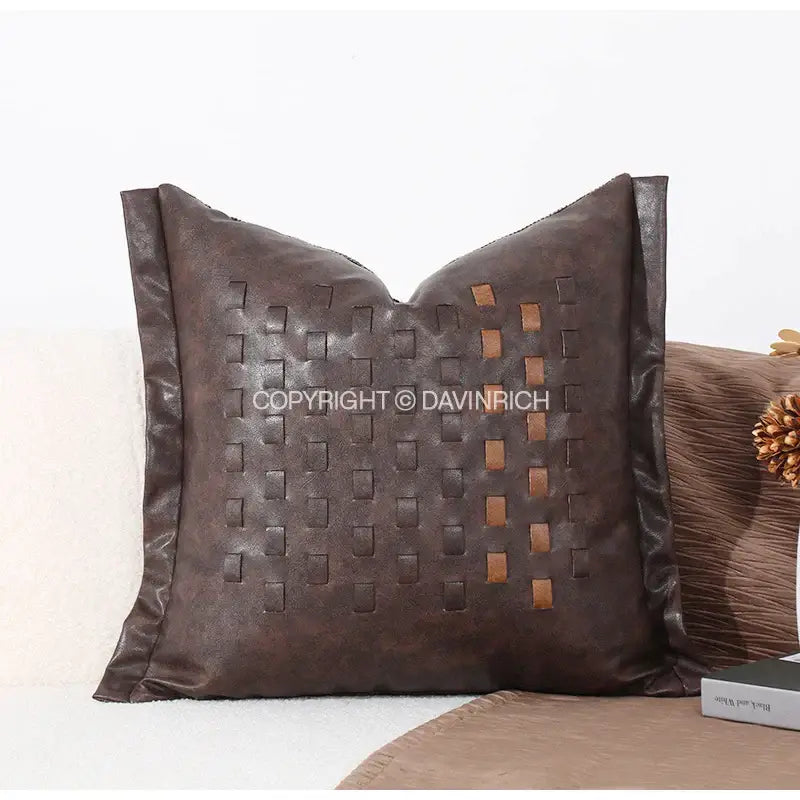 Brown leather throw pillow with woven lighter brown accents cushion cover brighton cross stitch design for living room