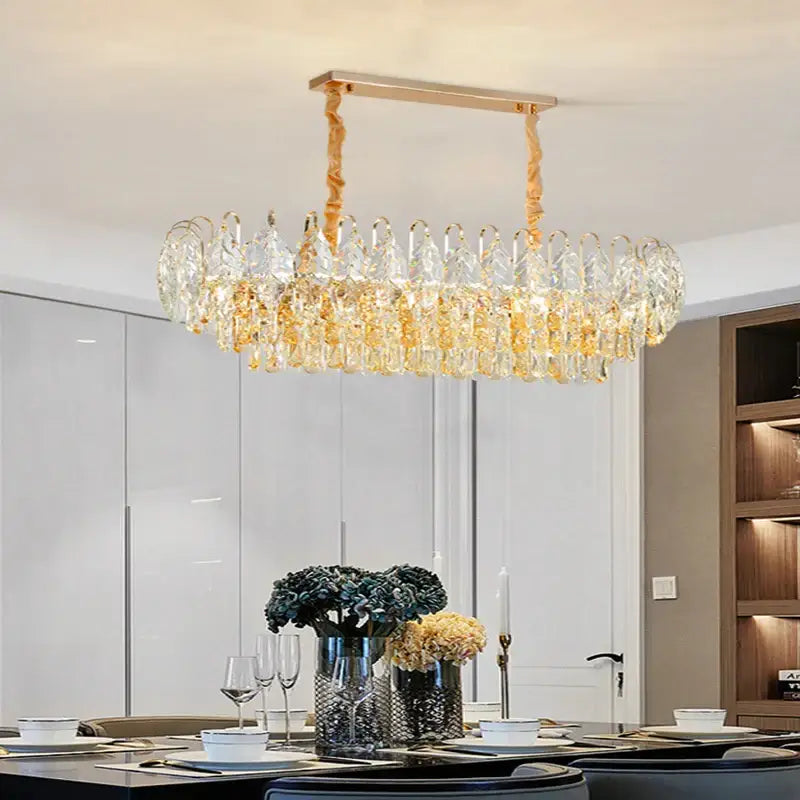 A modern brilliance crystal chandelier with gold-toned frame and cascading prisms for living room decorbites brilliance crystal
