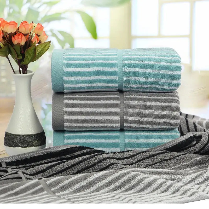 British style turquoise and gray striped sports fitness towel with soft textured cotton weave for gym use