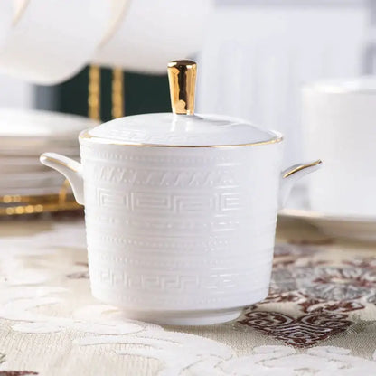 White ceramic sugar bowl with gold-trimmed lid and embossed greek key pattern from british white tea set decorbites bone