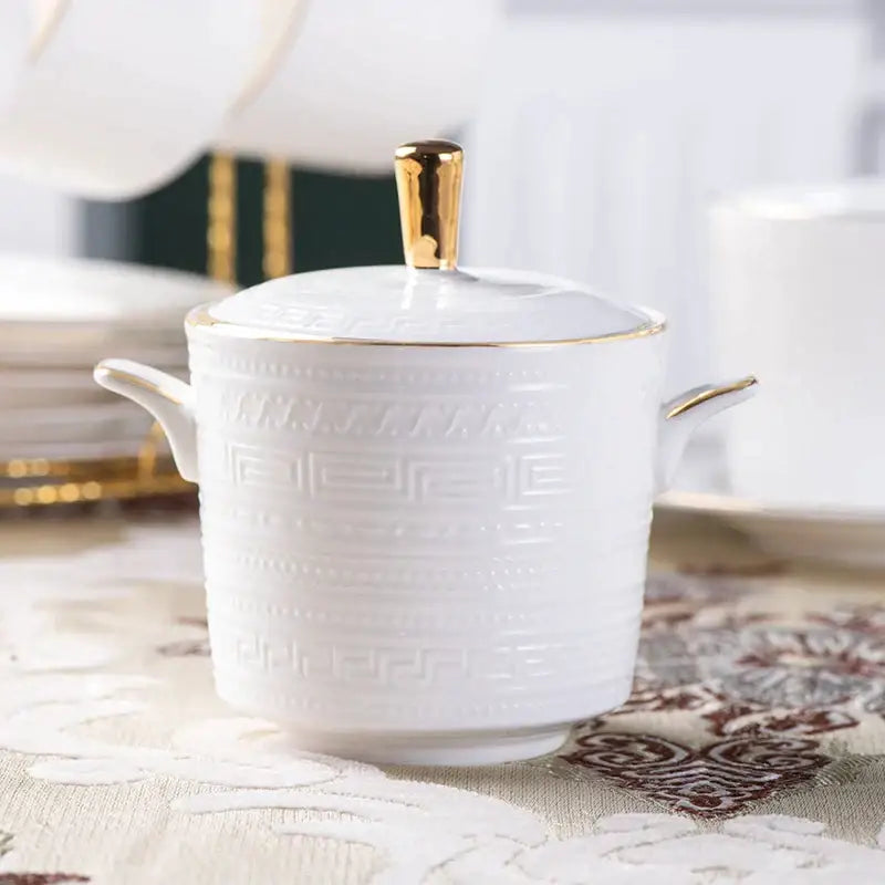 White ceramic sugar bowl with gold-trimmed lid and embossed greek key pattern from british white tea set decorbites bone