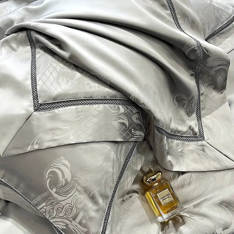 A luxurious silver-gray satin throw blanket with embossed floral brocade satin jacquard and black lace trim decorbites bedding set