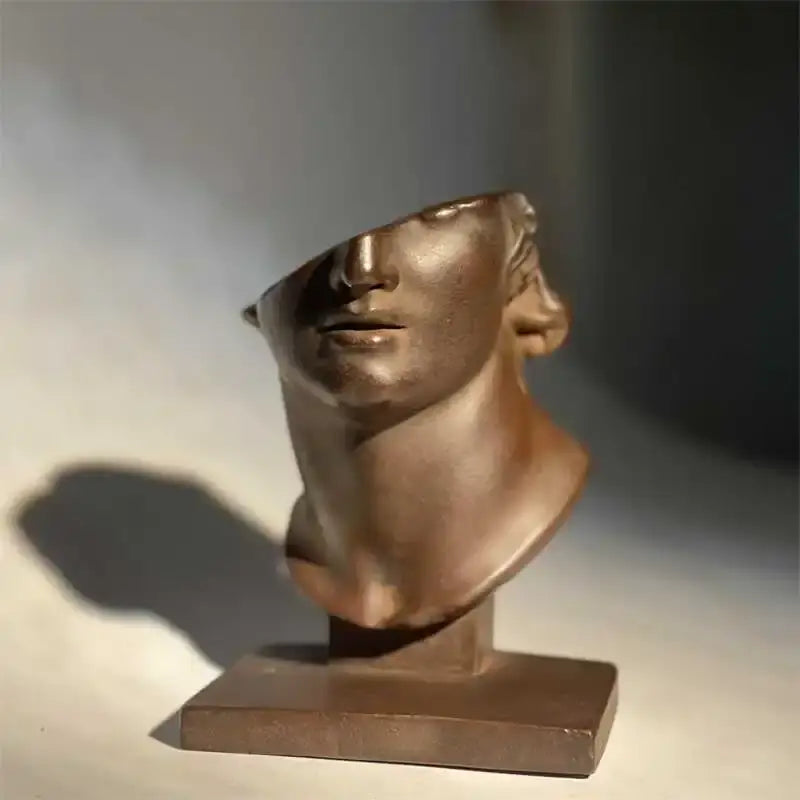 Bronze abstract human face sculpture with smooth polished surface and stylized features for living room decorbites decor