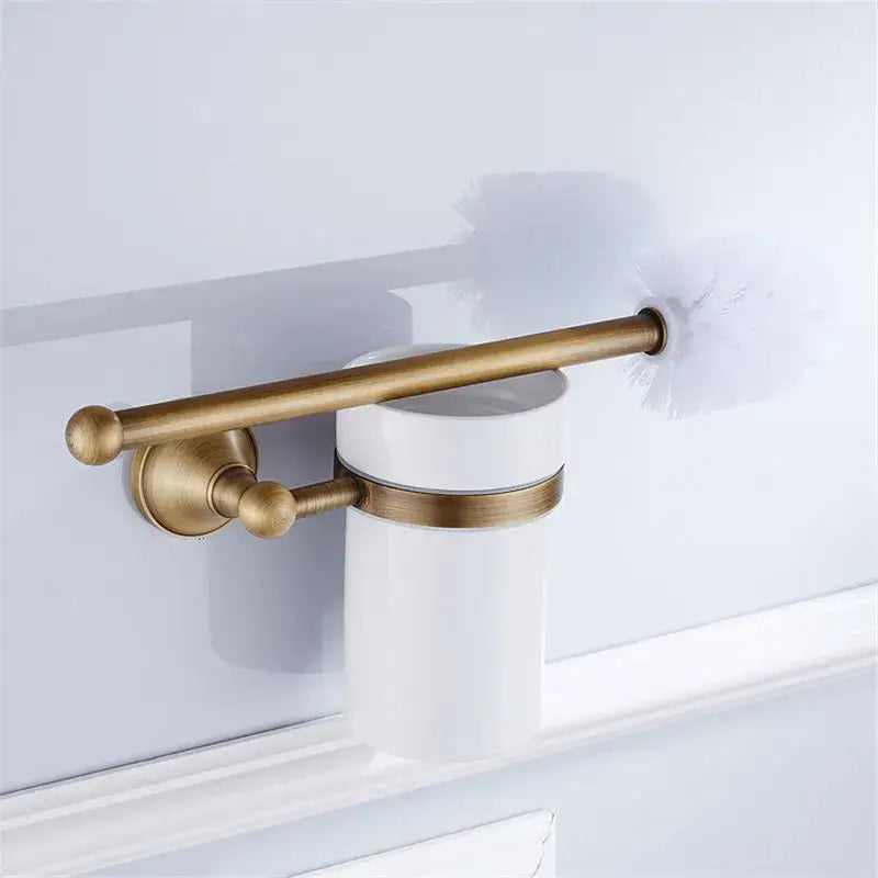 Antique brass toilet brush holder with white ceramic cup and decorative rod from decorbites bronze bathroom accessories set