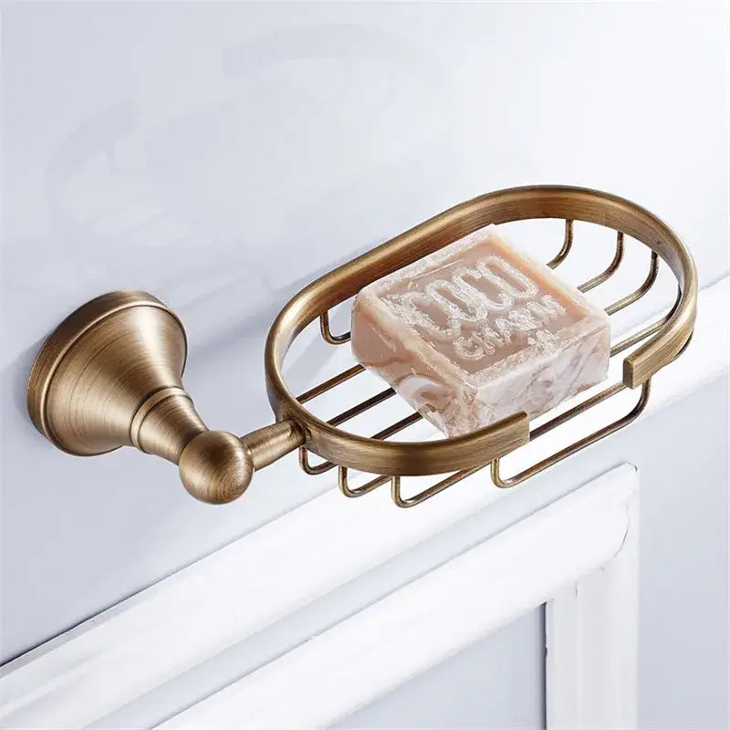 Antique brass-finished metal soap dish with oval wire mesh design from decorbites bronze bathroom accessories set