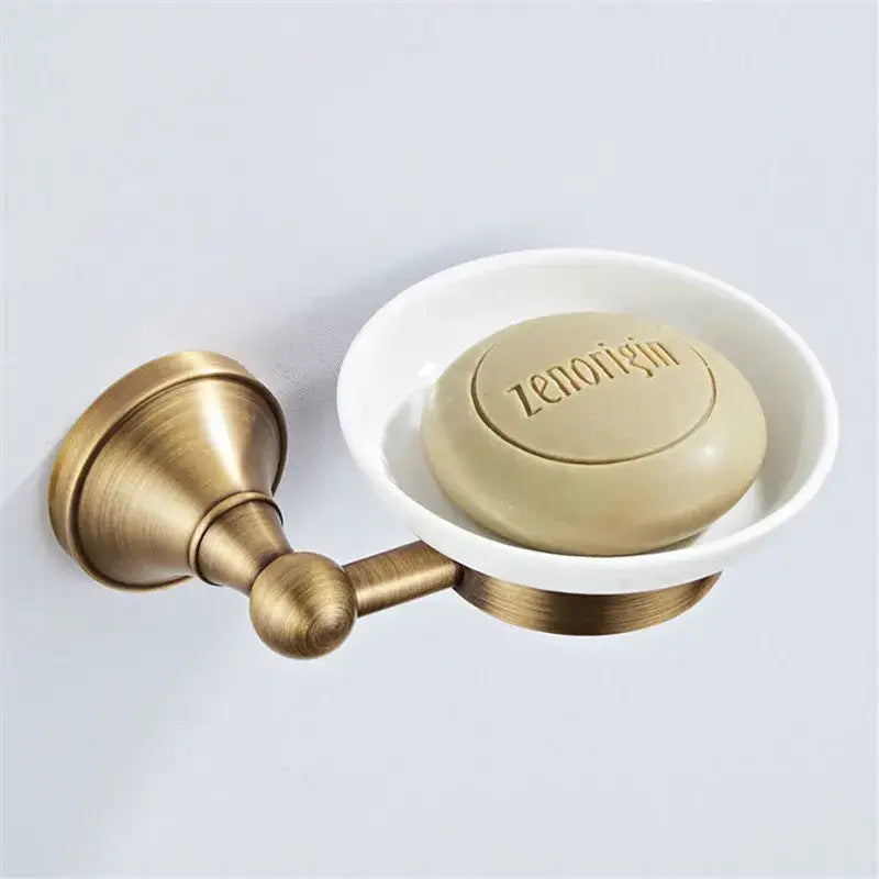 Antique brass-finished wall-mounted soap dish with beige zenorigin soap in bronze bathroom accessories set decorbites bronze bathroom