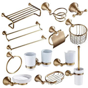 Brass-finished bronze bathroom accessories set with white ceramic cups and soap dish for elegant bathroom decorbites decor