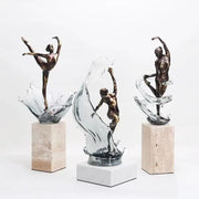 Bronze ballet dancer figure with flowing glass splash effect mounted on stone pedestal for elegant home decor