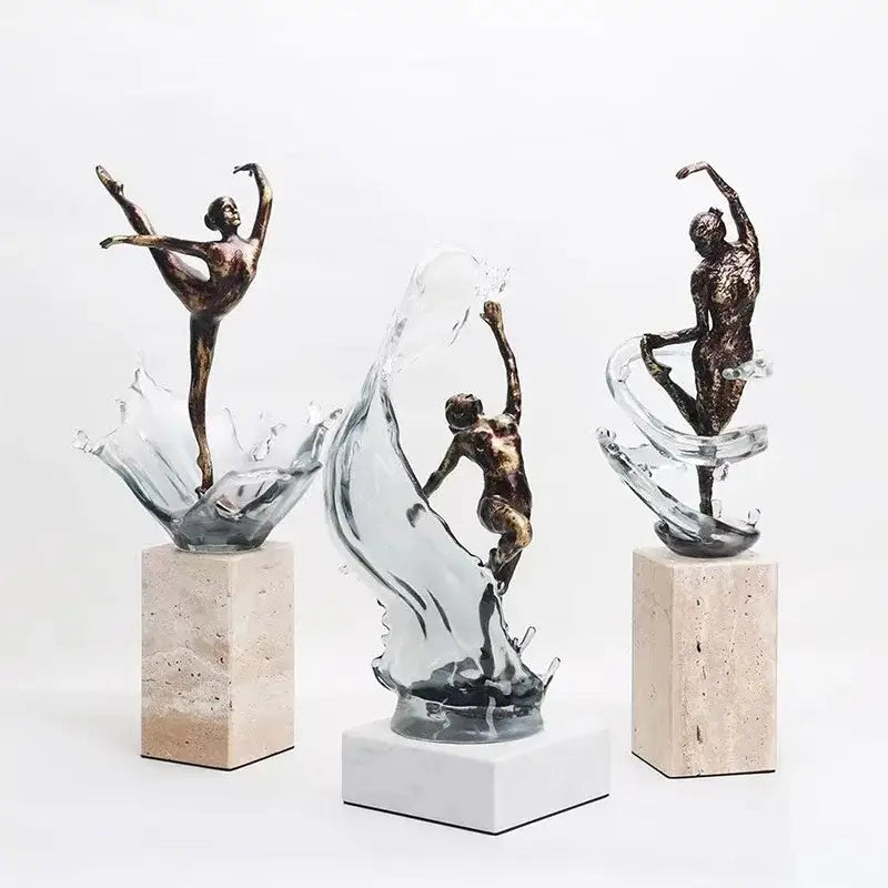 Bronze ballet dancer figure with flowing glass splash effect mounted on stone pedestal for elegant home decor