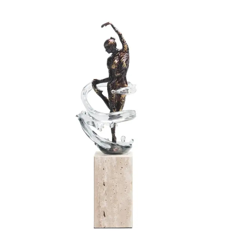 Bronze ballet dancer figure with flowing glass ribbon on beige stone pedestal for elegant home decor